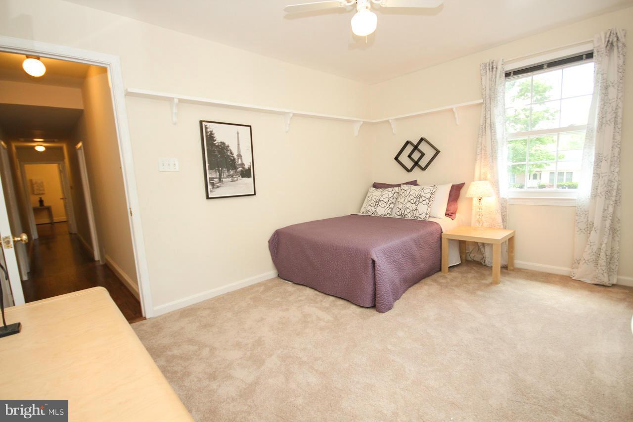 14305 Piccadilly Road Silver Spring, MD 20906 - Photo 19 of 30 a bedroom with a bed and a window
