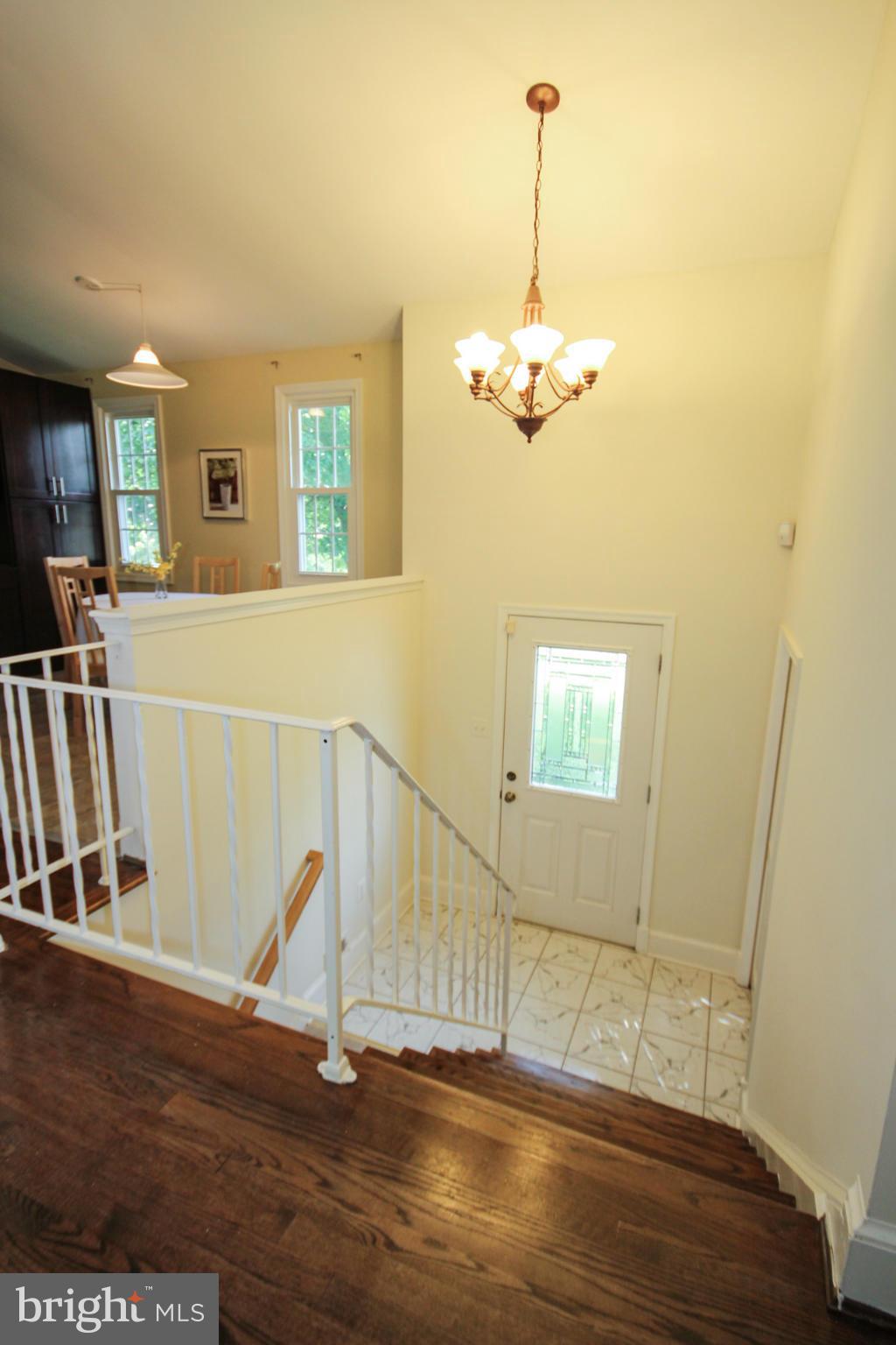 14305 Piccadilly Road Silver Spring, MD 20906 - Photo 3 of 30 a view of a room with wooden floor and ceiling fan