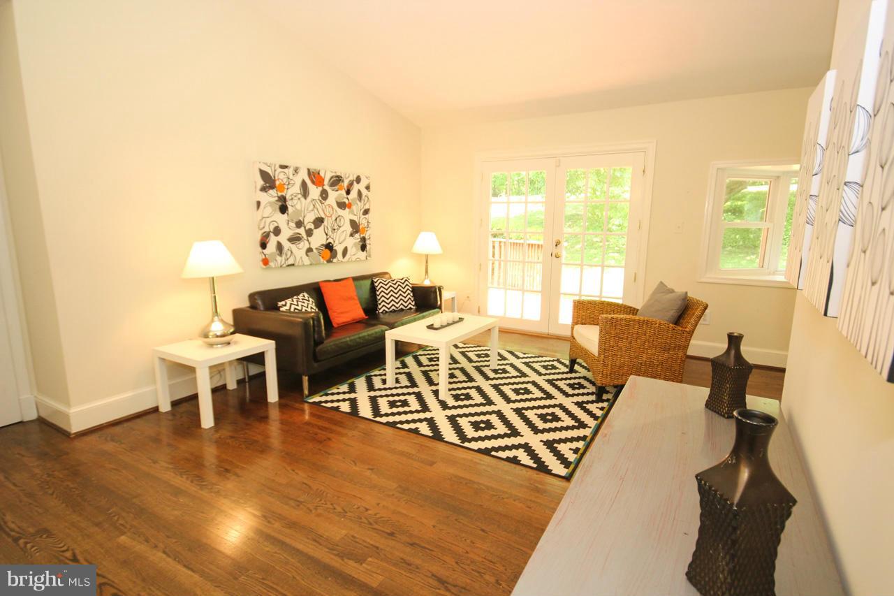 14305 Piccadilly Road Silver Spring, MD 20906 - Photo 4 of 30 a living room with furniture and a large window