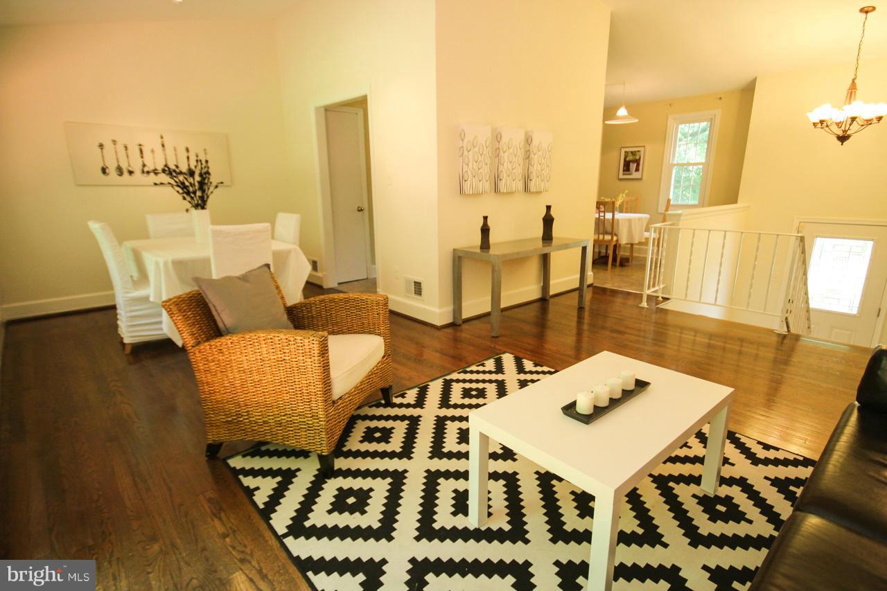 14305 Piccadilly Road Silver Spring, MD 20906 - Photo 7 of 30 a view of a dining room with furniture and wooden floor