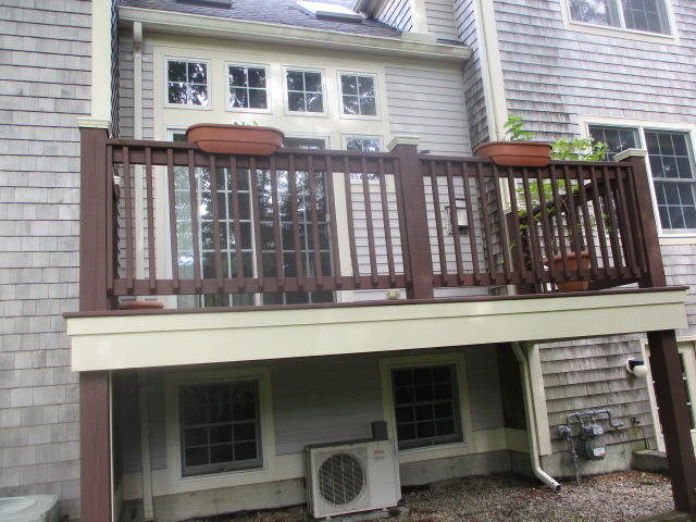 15 Gold Leaf Lane Mashpee, MA 02649 - Photo 14 of 14 a front view of a house with glass windows