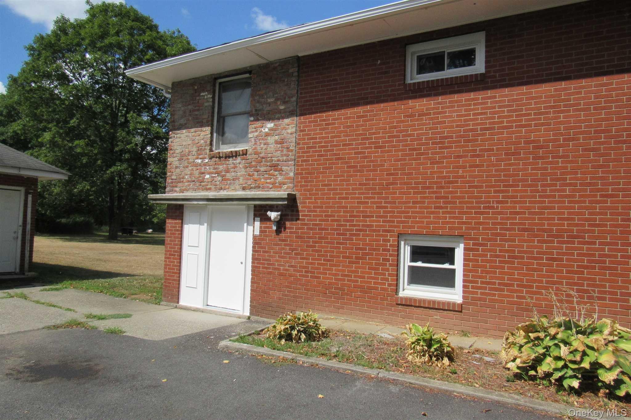 1425 Highway 82, Unit B Hopewell Junction, NY 12533 - Photo 1 of 19 a front view of a house with a yard