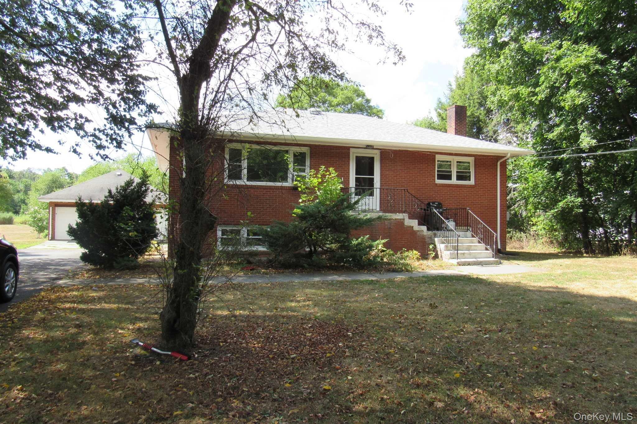 1425 Highway 82, Unit B Hopewell Junction, NY 12533 - Photo 2 of 19 a front view of a house with garden