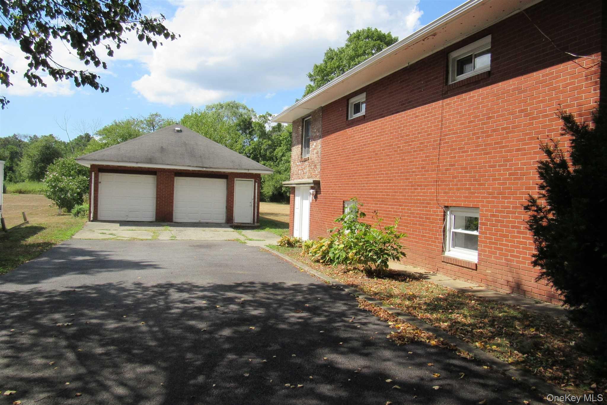 1425 Highway 82, Unit B Hopewell Junction, NY 12533 - Photo 3 of 19 a front view of a house with a garden