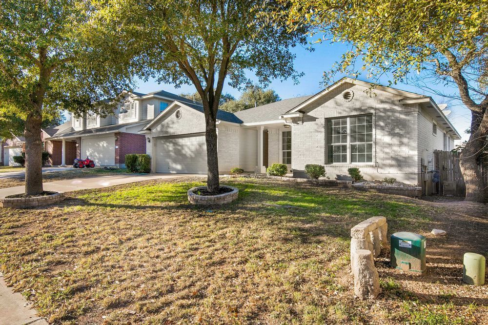 3310 Blue Ridge Drive Round Rock, TX 78681 - Photo 2 of 13 A classic brick exterior with an attached garage welcomes you home to this charming residence.