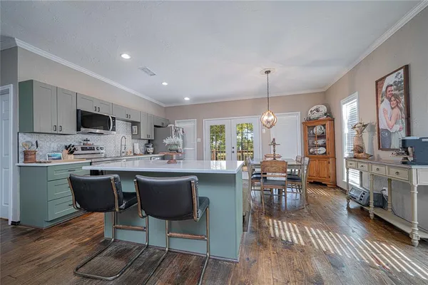 a kitchen with a refrigerator and a sink