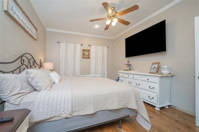 a bathroom with a granite countertop double vanity sink a mirror and shower