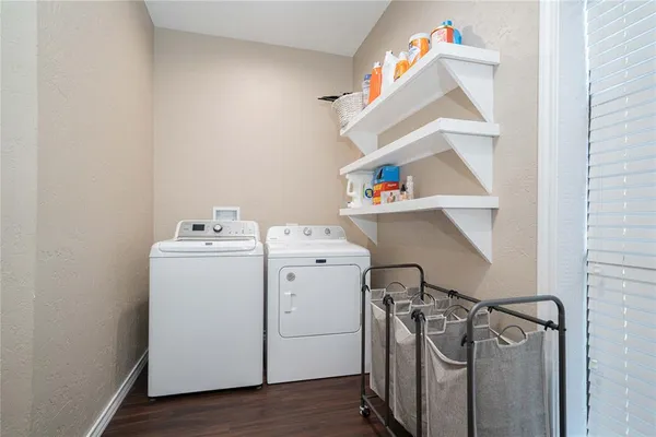 a bathroom with a toilet sink vanity and mirror