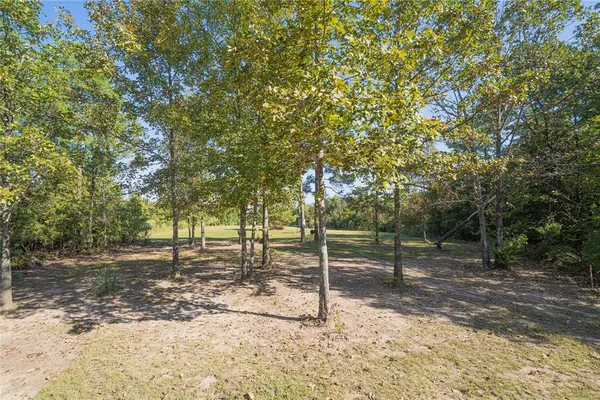 a view of a patio with table and chairs and couches