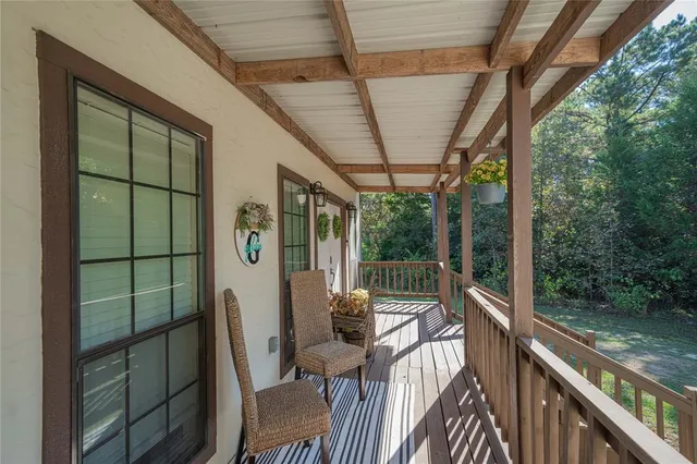 a view of balcony with wooden floor