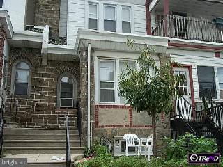 276 Avon Road Upper Darby, PA 19082 - Photo 1 of 1 a front view of a house with plants