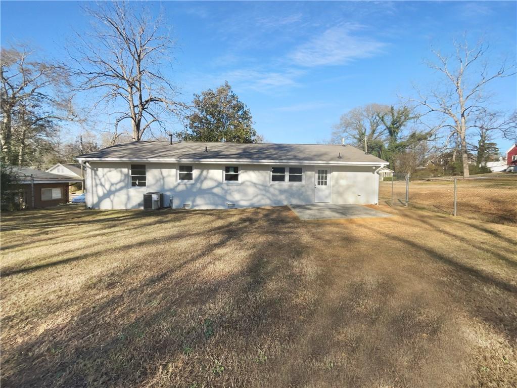 314 Jackson Street Cartersville, GA 30120 - Photo 5 of 18 a view of a house with a yard
