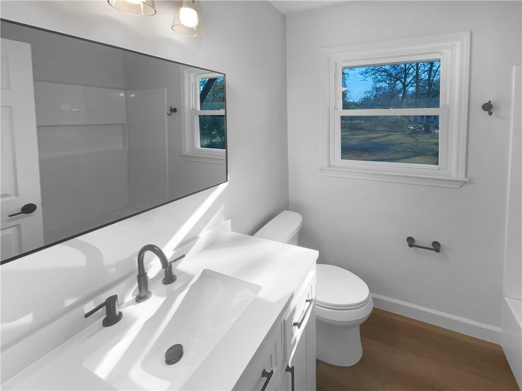 314 Jackson Street Cartersville, GA 30120 - Photo 7 of 18 a bathroom with a sink and a toilet
