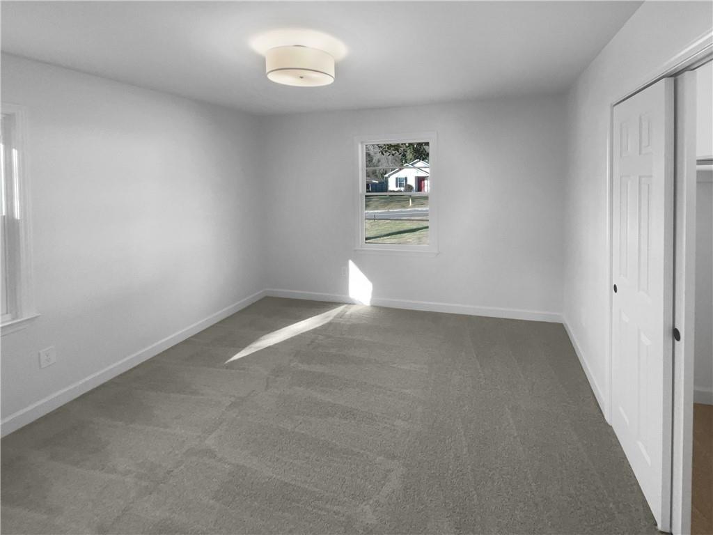 314 Jackson Street Cartersville, GA 30120 - Photo 8 of 18 an empty room with windows