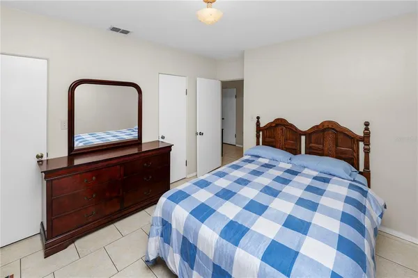 a bedroom with a bed and a cabinets