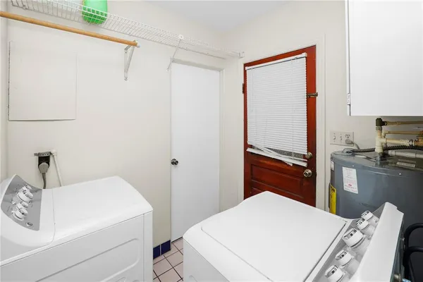 a room with furniture and a potted plant