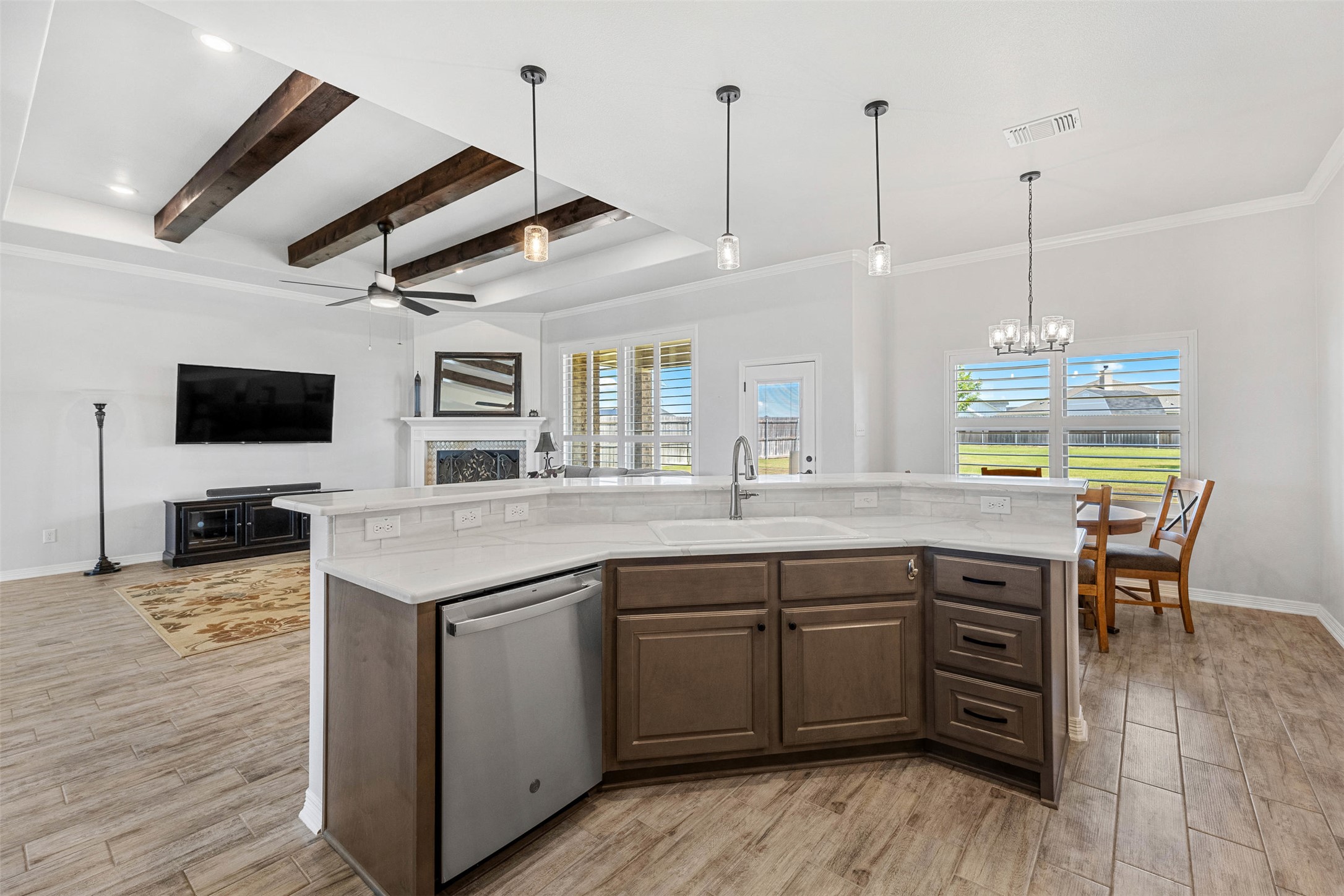 5513 Hollow Loop Salado, TX 76571 - Photo 13 of 36 a kitchen with stainless steel appliances granite countertop a sink a stove and a wooden floors