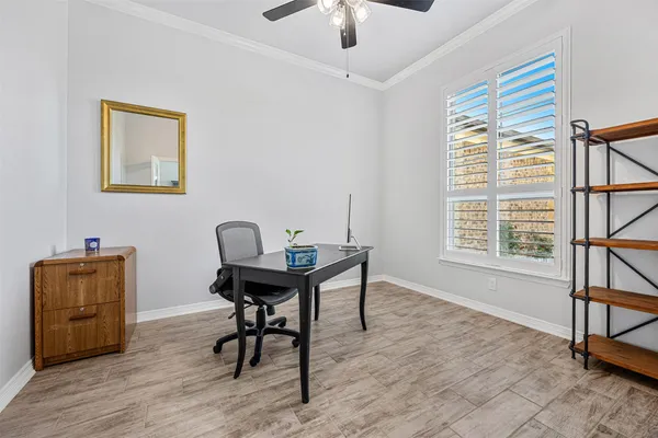 a work room with furniture and window