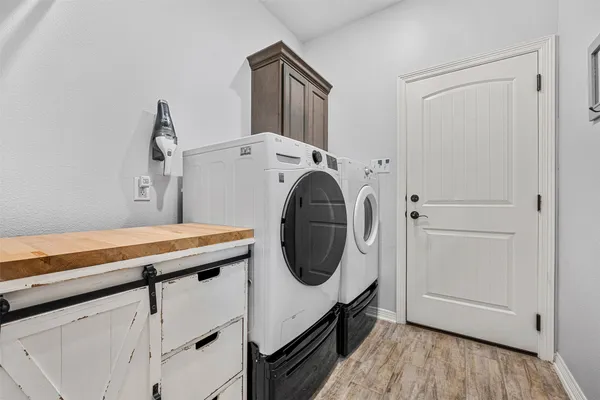 a utility room with dryer and washer