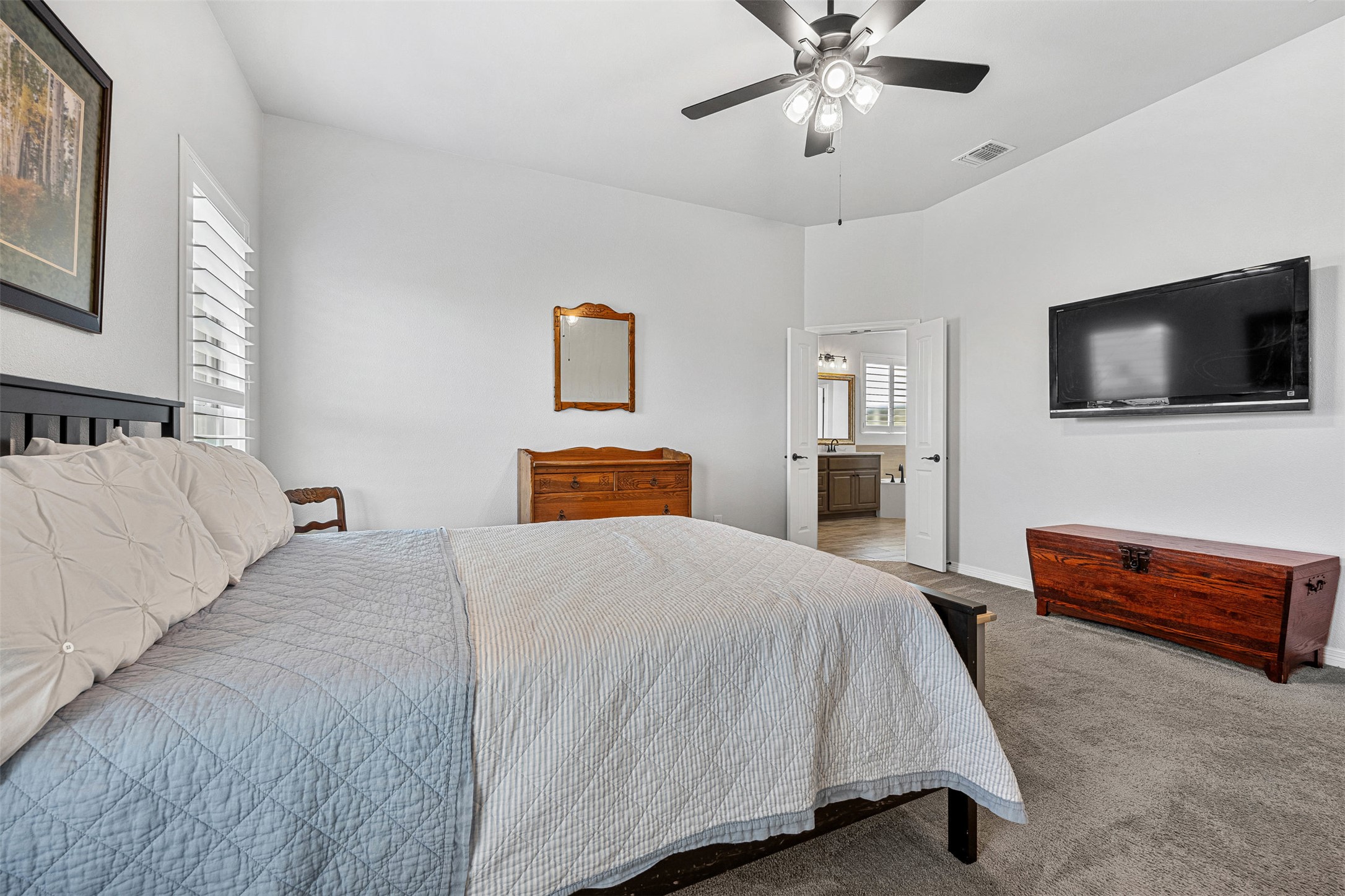5513 Hollow Loop Salado, TX 76571 - Photo 20 of 36 a bedroom with a bed and a flat screen tv