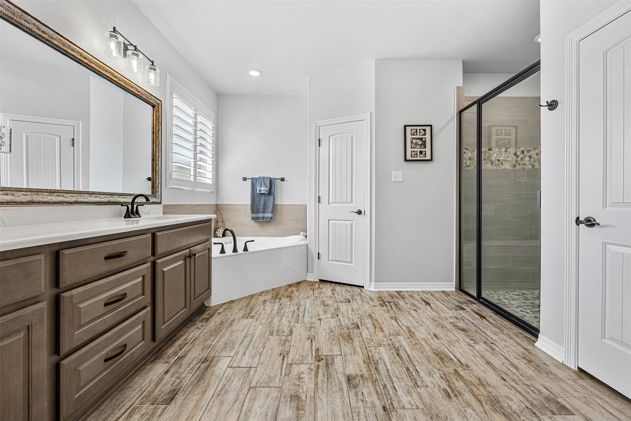 5513 Hollow Loop Salado, TX 76571 - Photo 23 of 36 a spacious bathroom with a shower a sink and a mirror