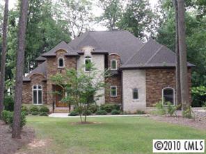3200 Lake Shore Road South Denver, NC 28037 - Photo 1 of 16 a front view of a house with a garden