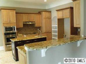 3200 Lake Shore Road South Denver, NC 28037 - Photo 7 of 16 a kitchen with a stove and a refrigerator