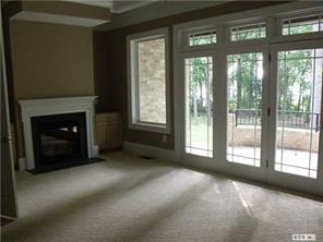 3200 Lake Shore Road South Denver, NC 28037 - Photo 8 of 16 a view of an empty room with a fireplace