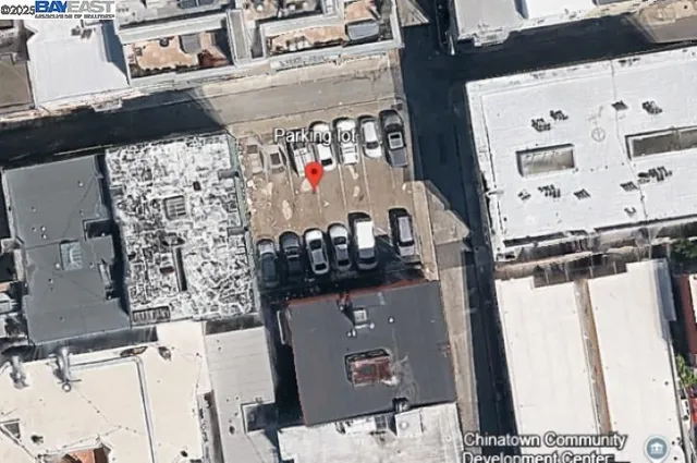 a view of a city street with cars