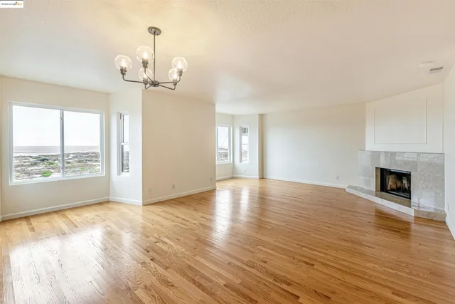 a view of kitchen and wooden floor