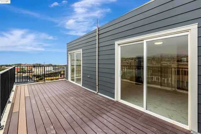 a view of a balcony with wooden floor