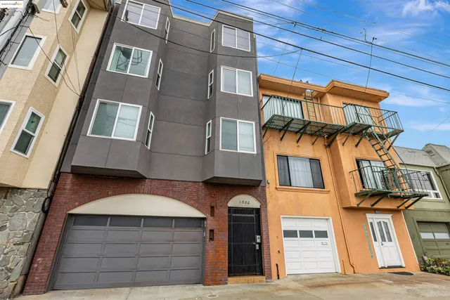a front view of a house with a garage
