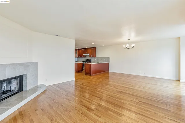 a view of a kitchen with a sink and a fireplace