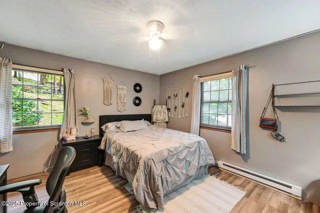 a bathroom with a granite countertop shower and a sink