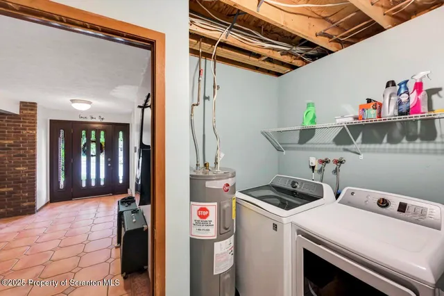 a view of a chair and table in backyard of the house