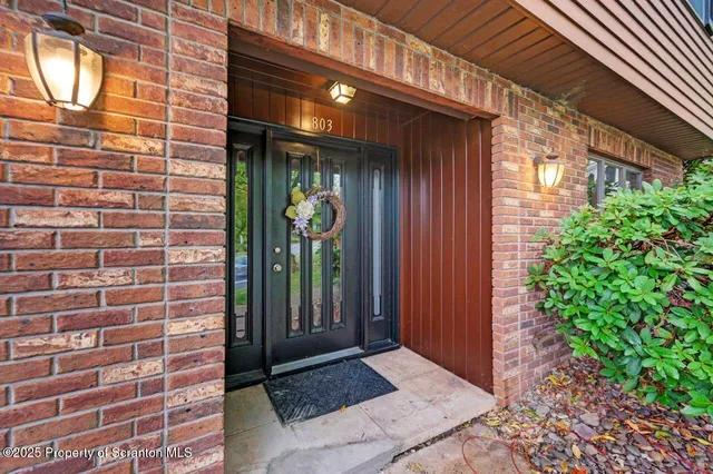 a living room with furniture window and a fireplace
