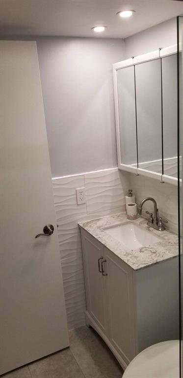 320 South Surf Road, Unit 704 Hollywood, FL 33019 - Photo 14 of 20 a bathroom with a granite countertop sink and a mirror