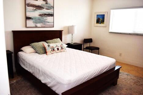 320 South Surf Road, Unit 704 Hollywood, FL 33019 - Photo 15 of 20 a large bed sitting in a bedroom next to a window