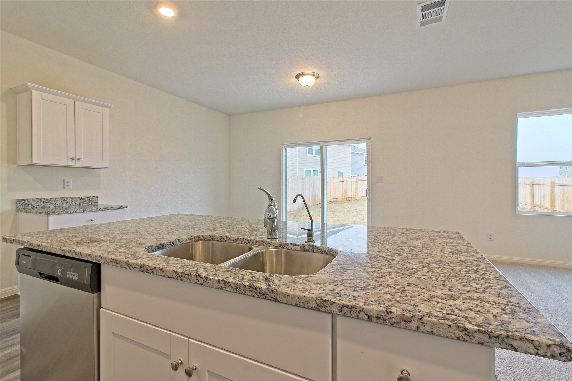 109 Gemsbok Road Hutto, TX 78634 - Photo 11 of 30 a kitchen that has a sink and a granite counter tops