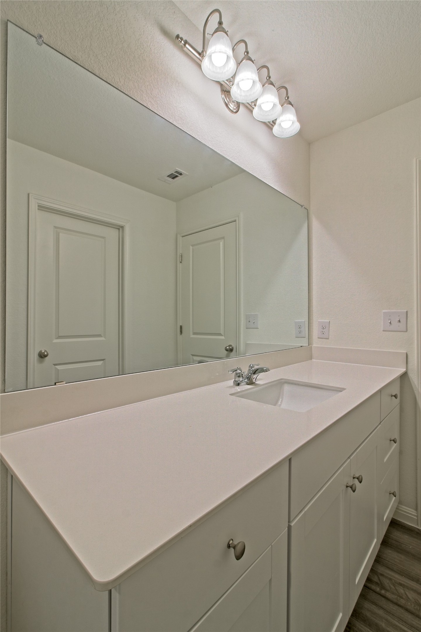 109 Gemsbok Road Hutto, TX 78634 - Photo 20 of 30 a bathroom with a sink vanity and a mirror