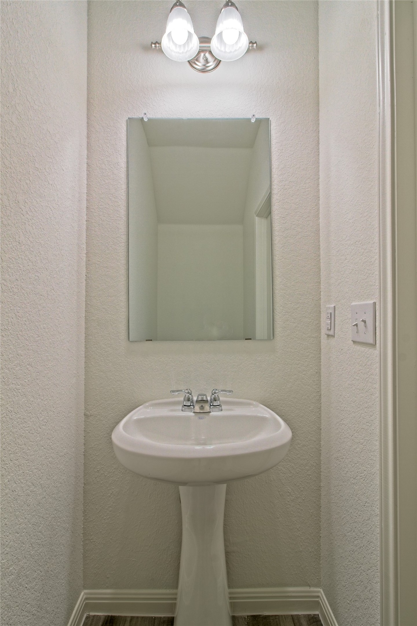 109 Gemsbok Road Hutto, TX 78634 - Photo 24 of 30 a bathroom with a sink and a mirror