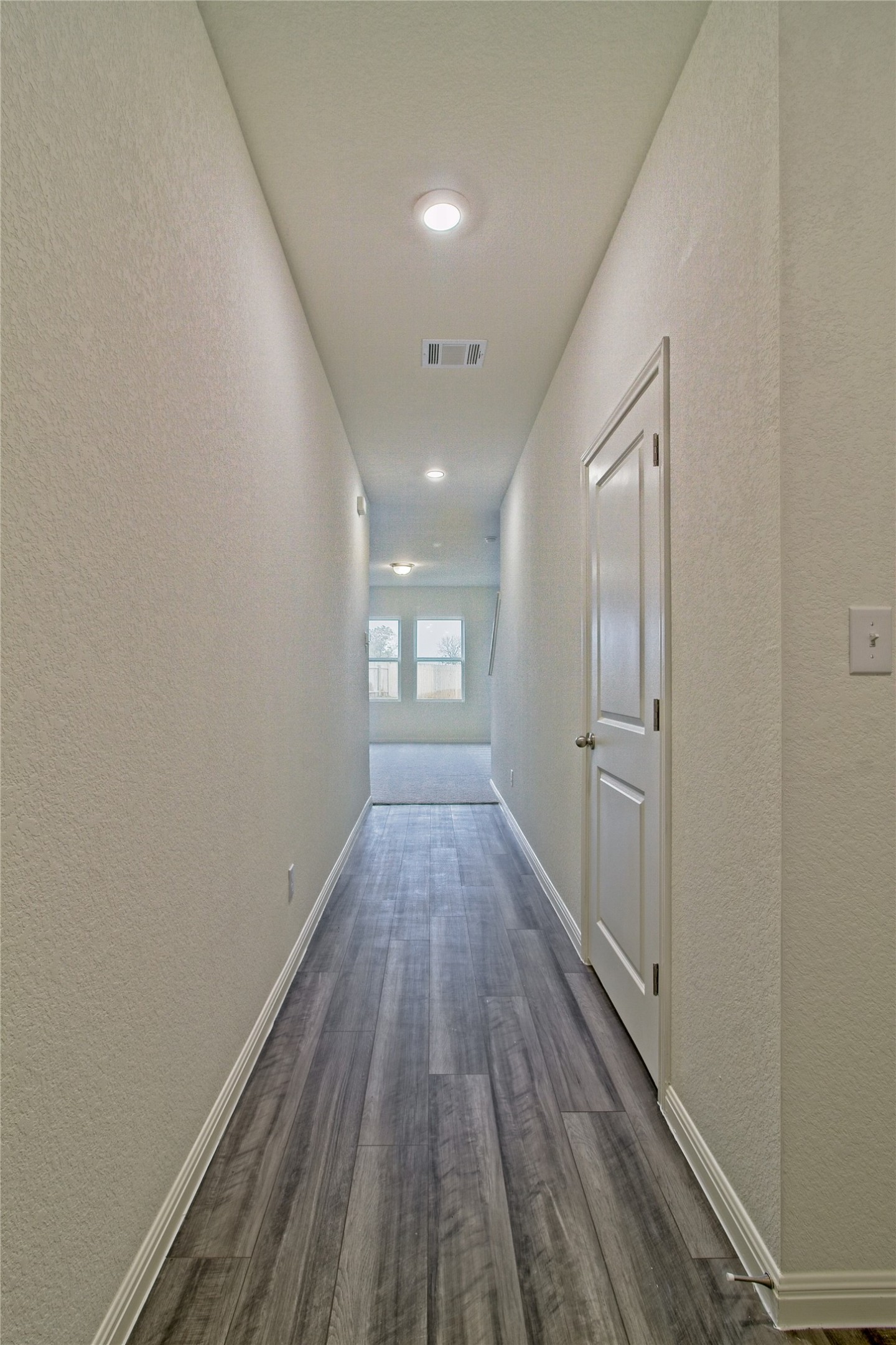 109 Gemsbok Road Hutto, TX 78634 - Photo 5 of 30 a view of a hallway with wooden floor