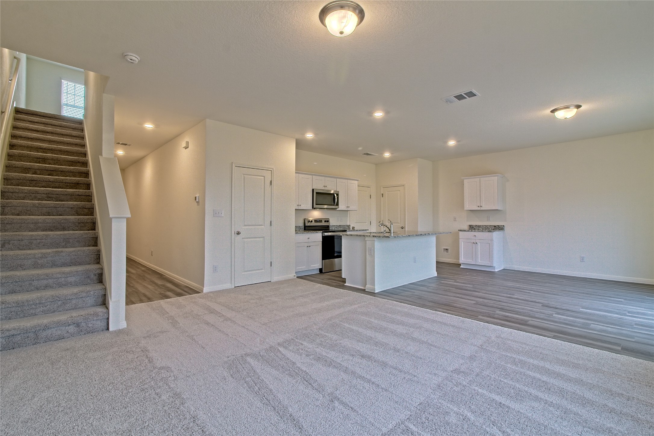 109 Gemsbok Road Hutto, TX 78634 - Photo 6 of 30 a view of kitchen with kitchen island and stainless steel appliances