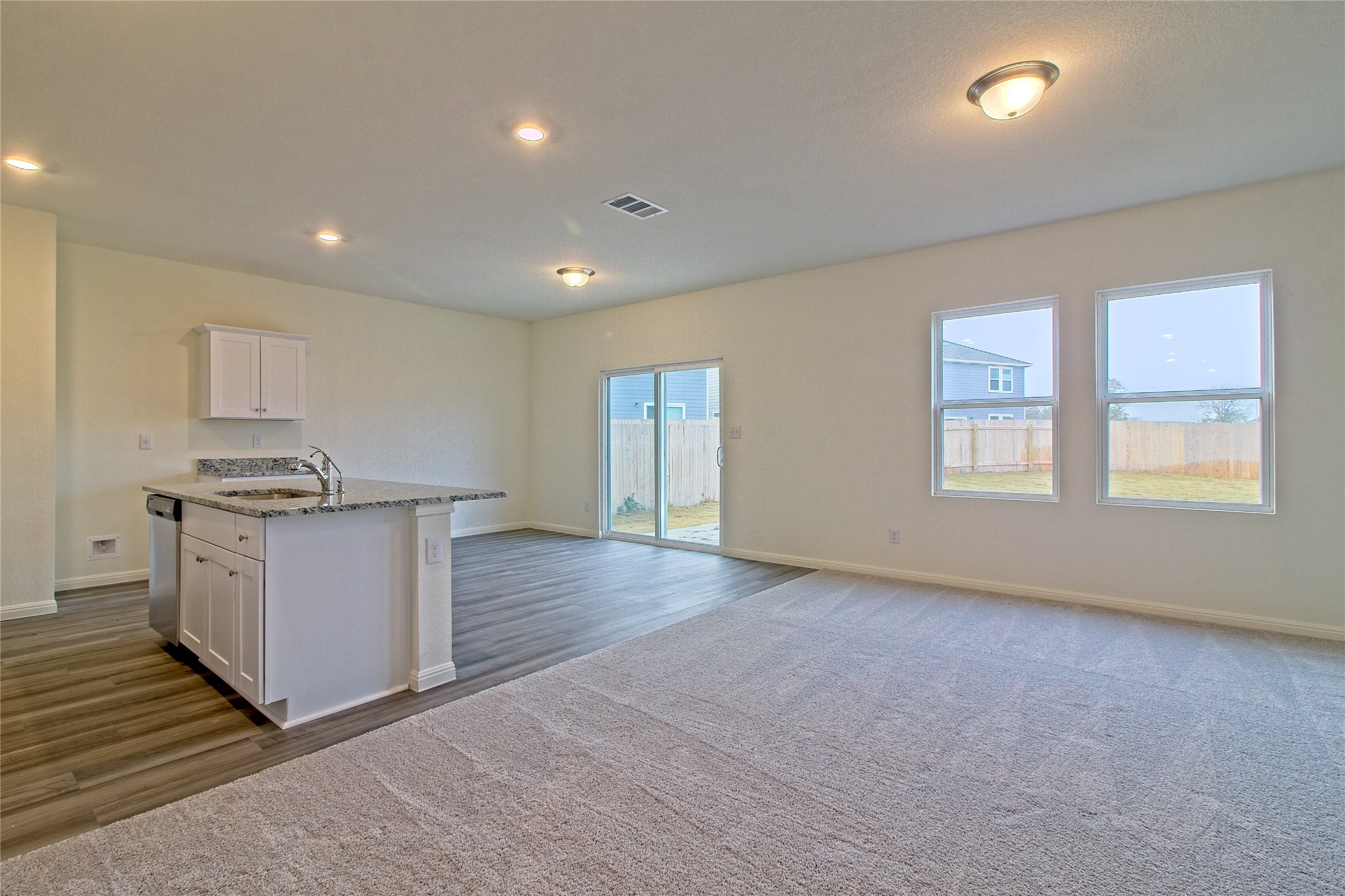 109 Gemsbok Road Hutto, TX 78634 - Photo 7 of 30 a view of kitchen with stove and wooden cabinets