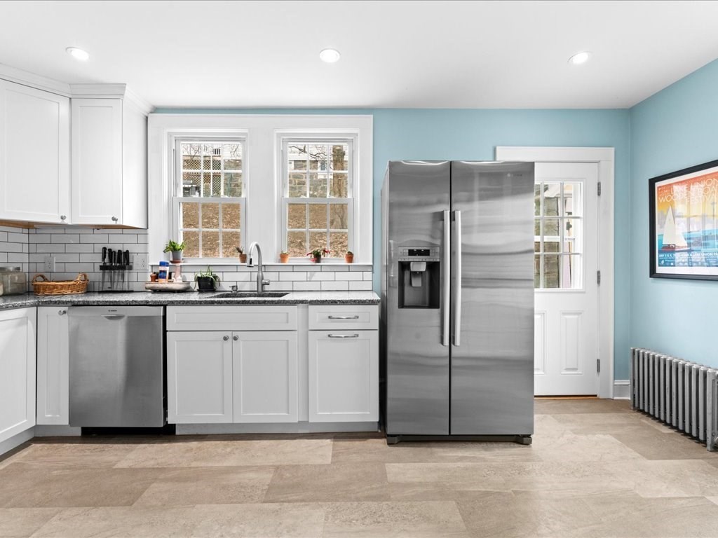 40 Lake Shore Road Boston, MA 02135 - Photo 15 of 39 a kitchen with a refrigerator sink and cabinets