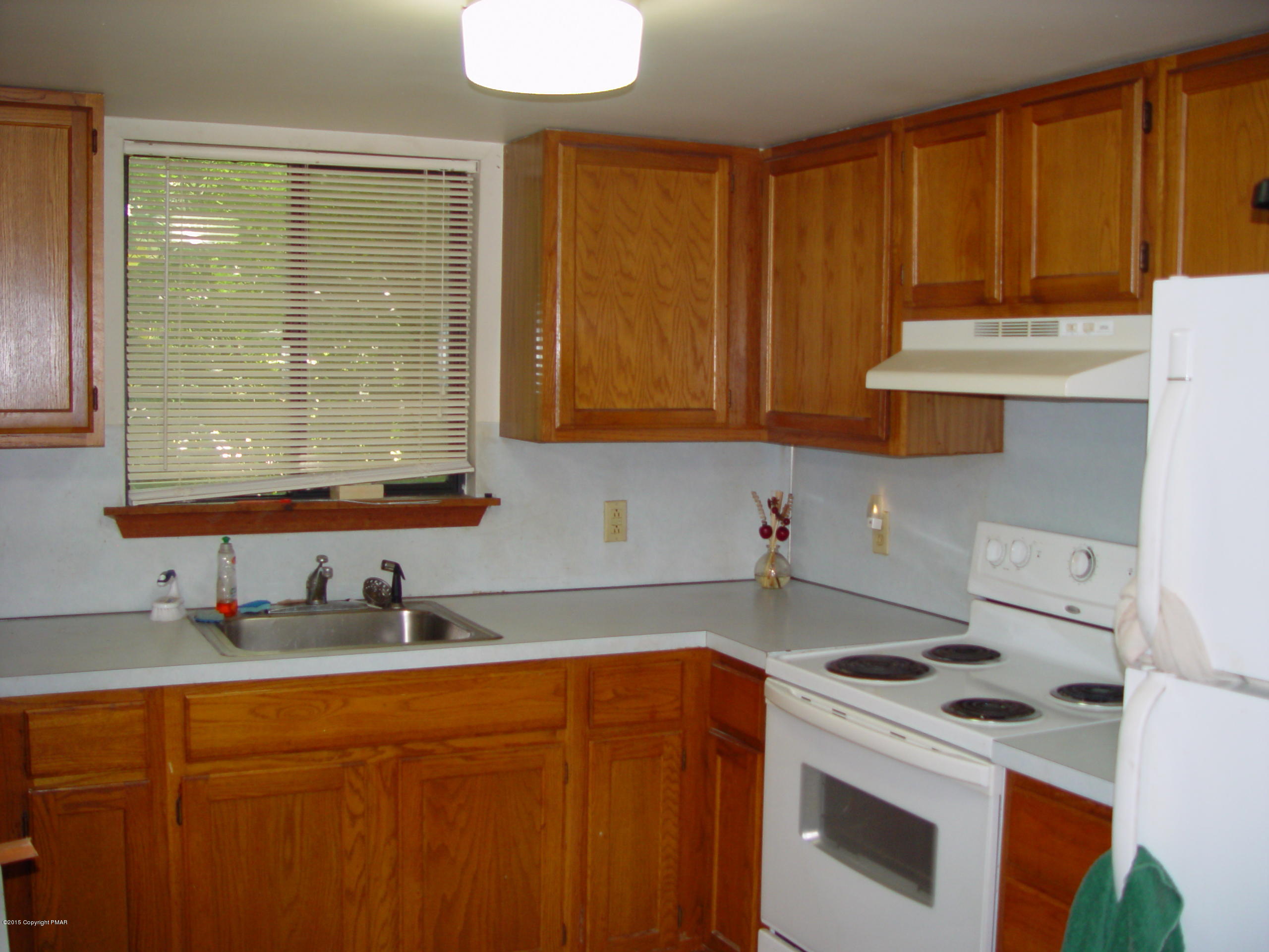 29 Old Post Road Tobyhanna, PA 18466 - Photo 5 of 16 a kitchen with stainless steel appliances a stove a sink and a microwave