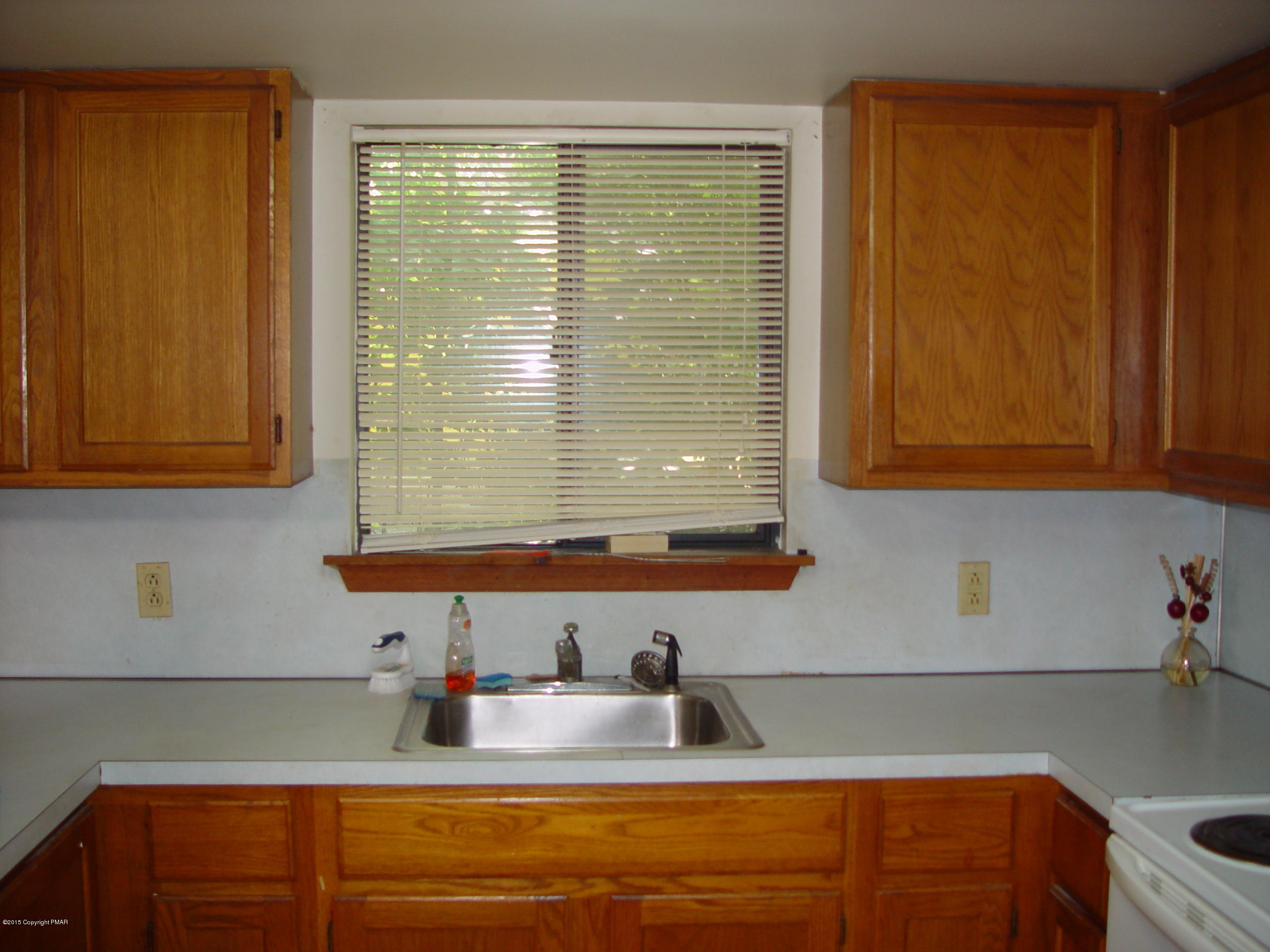 29 Old Post Road Tobyhanna, PA 18466 - Photo 6 of 16 a kitchen with stainless steel appliances wooden cabinets and a sink