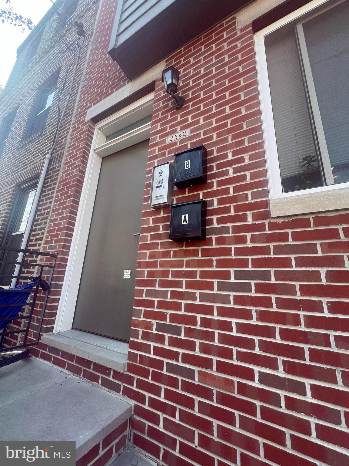 2542 Ellsworth Street, Unit A Philadelphia, PA 19146 - Photo 2 of 21 a brick building with a door and a window