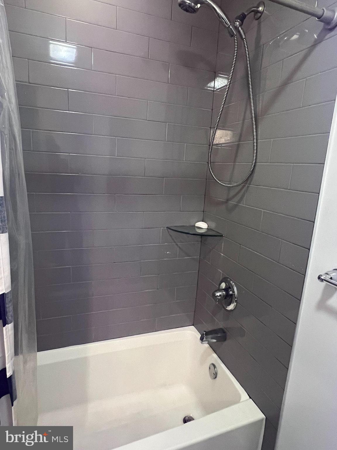 2542 Ellsworth Street, Unit A Philadelphia, PA 19146 - Photo 8 of 21 a bathroom with a bath tub and shower