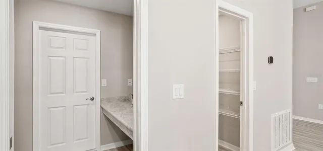 a bathroom with a granite countertop sink